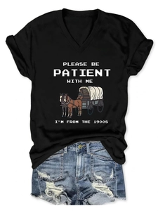 Flat lay of black V-neck T-shirt with vintage print and ripped denim shorts outfit