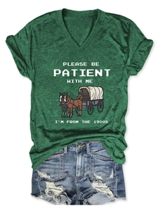 Detail of V-neck T-shirt with 1900s pixel text print and distressed denim shorts