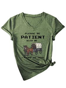 Detail of V-neck dark green T-shirt featuring vintage text print and decorative hem knot