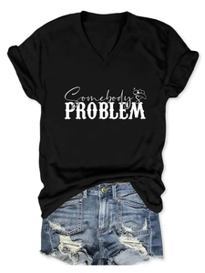 Detail of V-neck cotton T-shirt with Somebody's Problem print and ripped denim shorts