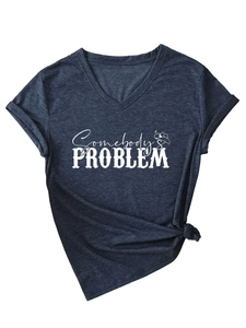 Detail of grey V-neck T-shirt with Somebody's Problem print and cowboy hat graphic