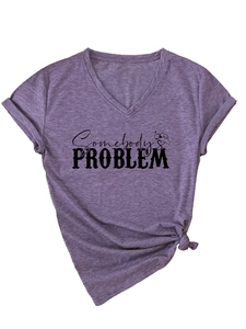 Detail of purple V-neck T-shirt with Somebody's Problem print and side knot hem