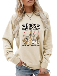 Détails des poignets côtelés et motif de chien sur un sweat-shirt couleur abricot