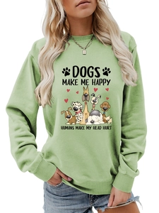 Détail du sweat vert clair avec illustration Dogs Make Me Happy et finitions côtelées