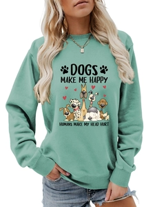 Détail du sweat vert menthe avec motifs de chiens et texte imprimé humoristique
