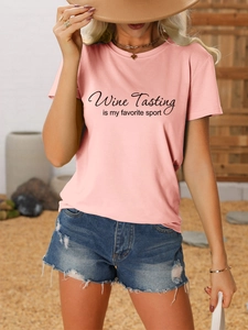 Close-up of Wine Tasting is my favorite sport printed on a pink cotton blend T-shirt