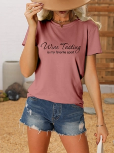 Outdoor lifestyle shot of a dusty rose t-shirt with Wine Tasting is my favorite sport print