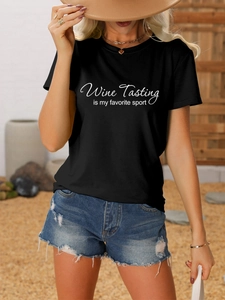 Detail of black cotton T-shirt featuring 'Wine Tasting' graphic print for summer