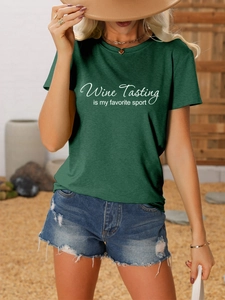 Detail of dark green t-shirt with Wine Tasting is my favorite sport slogan print