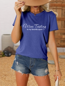 Detail of navy blue T-shirt featuring Wine Tasting is my favorite sport printed text