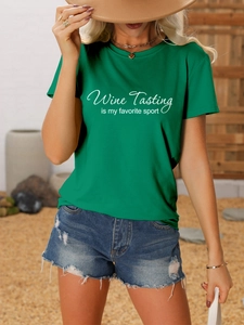 Detail of green Wine Tasting cotton T-shirt styled with denim shorts and golden jewelry