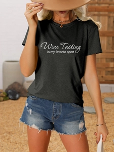 Detail of the Wine Tasting is My Favorite Sport white script print on a black cotton tee