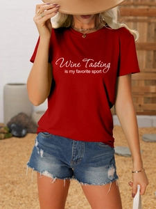 Detail of burgundy T-shirt with 'Wine Tasting is my favorite sport' printed text