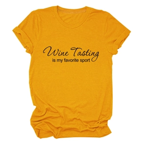 Close-up of yellow cotton t-shirt featuring Wine Tasting is my favorite sport text print