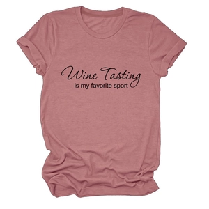 Close-up of pink cotton T-shirt with Wine Tasting Is My Favorite Sport print detail