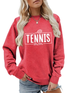 Close-up of Tennis Mom print on brick red sweatshirt with soft cotton texture