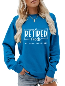 Detailed view of the royal blue sweatshirt with white RETIRED mode typography and ribbed cuffs