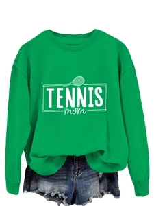 Close-up of green crewneck sweatshirt with white Tennis Mom print and ribbed cuffs
