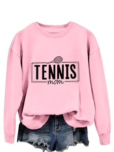 Detail of pink crewneck sweatshirt with Tennis Mom print and denim shorts combo
