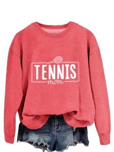 Detail of the Tennis Mom print and knit texture on the coral red crewneck sweatshirt