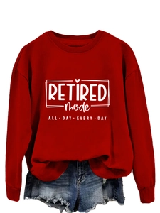 Close-up of Retired Mode print on red long sleeve sweatshirt with ribbed cuffs