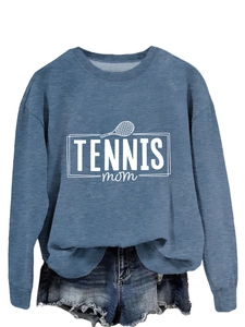 Flat lay of blue Tennis Mom sweatshirt paired with frayed denim shorts for casual style