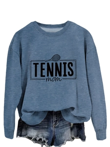 Detailed view of blue Tennis Mom sweatshirt with graphic print and denim shorts