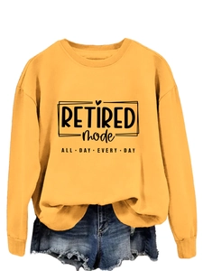 Detail of ginger yellow crewneck sweatshirt with black Retired Mode graphic print