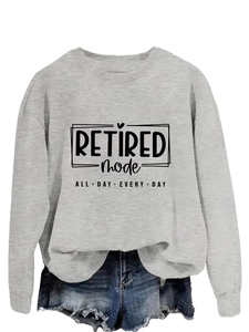 Detail of grey Retired Mode sweatshirt with heart graphic and frayed denim shorts set