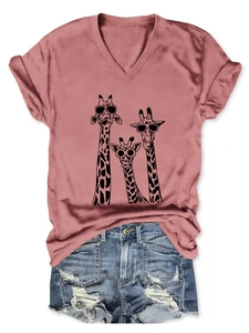 Close-up of summer V-neck T-shirt with three cartoon giraffes in dusty pink color
