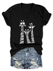 Detail of V-neck T-shirt with giraffe graphic and distressed denim shorts flat-lay