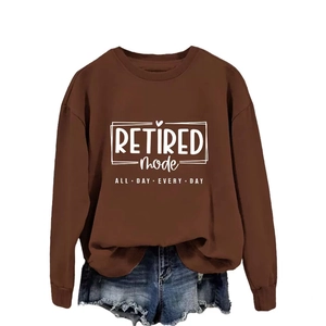 Brown Retired Mode sweatshirt paired with distressed blue denim shorts on white background
