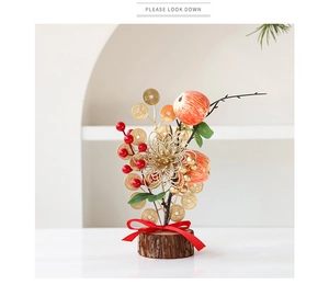 Detail of New Year desktop ornament with gold coins, red berries, and wood base