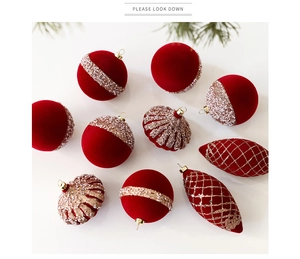 Detailed view of red flocked Christmas ornaments with gold and white beaded patterns