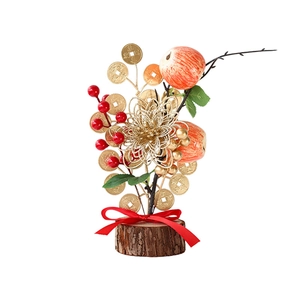 Festive table decor with red berries, golden flowers, and natural wood base for New Year