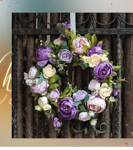 Detailed close-up of vintage peony and rose wreath on a rustic wooden background