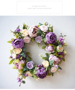Macro detail of artificial peony wreath with purple and cream flowers for door decoration