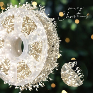 Warm white LED firecracker fairy lights with star spool for Christmas garden decoration