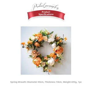 Dettaglio ghirlanda di peonie artificiali da 40cm con fiori di seta arancioni e crema