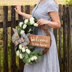 Artificial tulip eucalyptus wreath with a plaid bow and Welcome to our home wooden sign