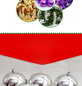 Close-up of shiny purple and silver Christmas baubles with decorative green pine garlands