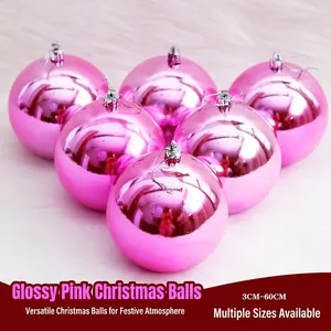 Shiny pink Christmas ball ornaments set with silver hooks for festive holiday tree decoration