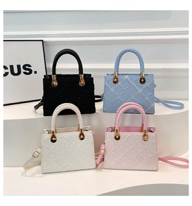 Quilted floral handbags in four colors featuring woven handles and gold hardware details