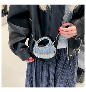 Silver metallic dumpling bag with vertical pleated texture and slim chain strap detail