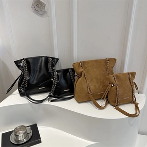 Set of suede and leather bucket bags in black and brown featuring fashion gold lettering