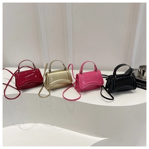 Mini glossy patent leather crossbody bags in red, gold, pink, and black colors