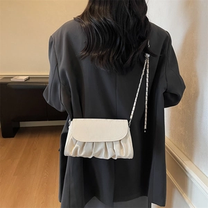 Chic pleated cloud bag in white PU leather with silver chain strap on shoulder