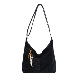 Large black leopard print hobo bag with ethnic beaded tassel and adjustable strap