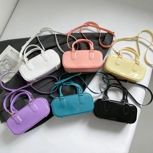 Glossy jelly pillow bags in six candy colors with adjustable shoulder straps