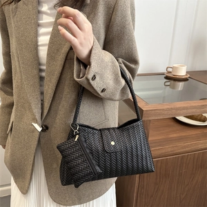Chic black woven shoulder bag set with textured underarm bag and matching mini pouch